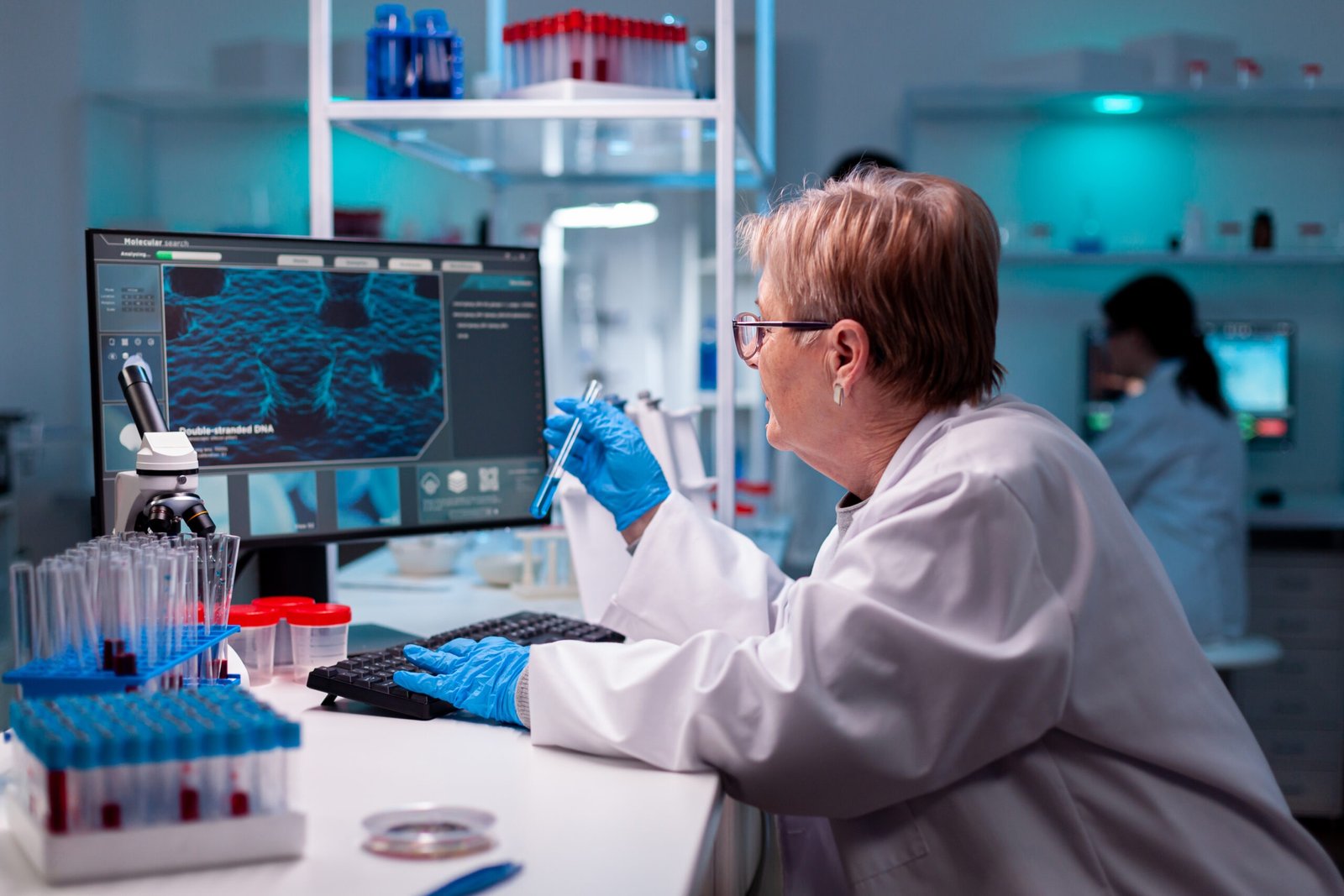 Test tube in modern engineering laborator medical virus, sample expertise. Chemist researcher working in laboratory with test tube to discovery vaccine against coronavirus.